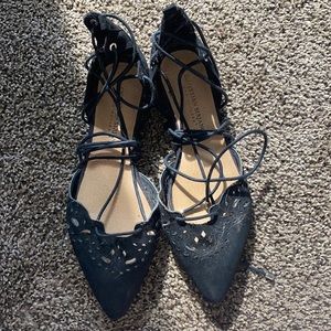 Black pointed dress shoes with silver accents, size 7 1/2